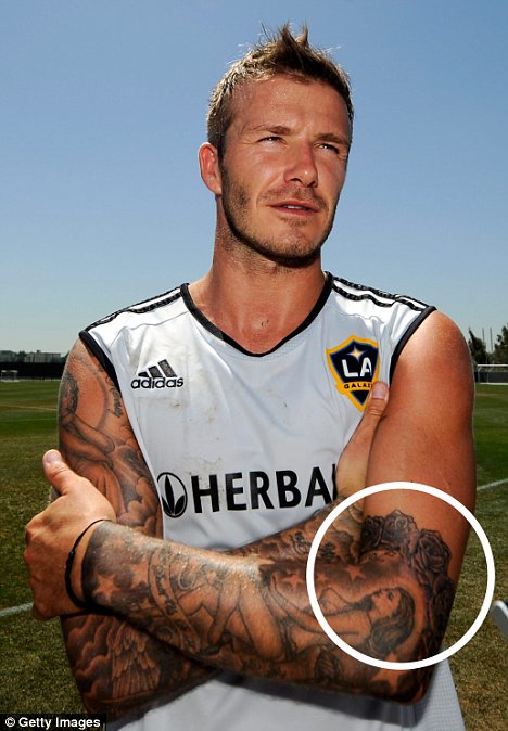 david beckham tattoos pictures. David Beckham is showing off a